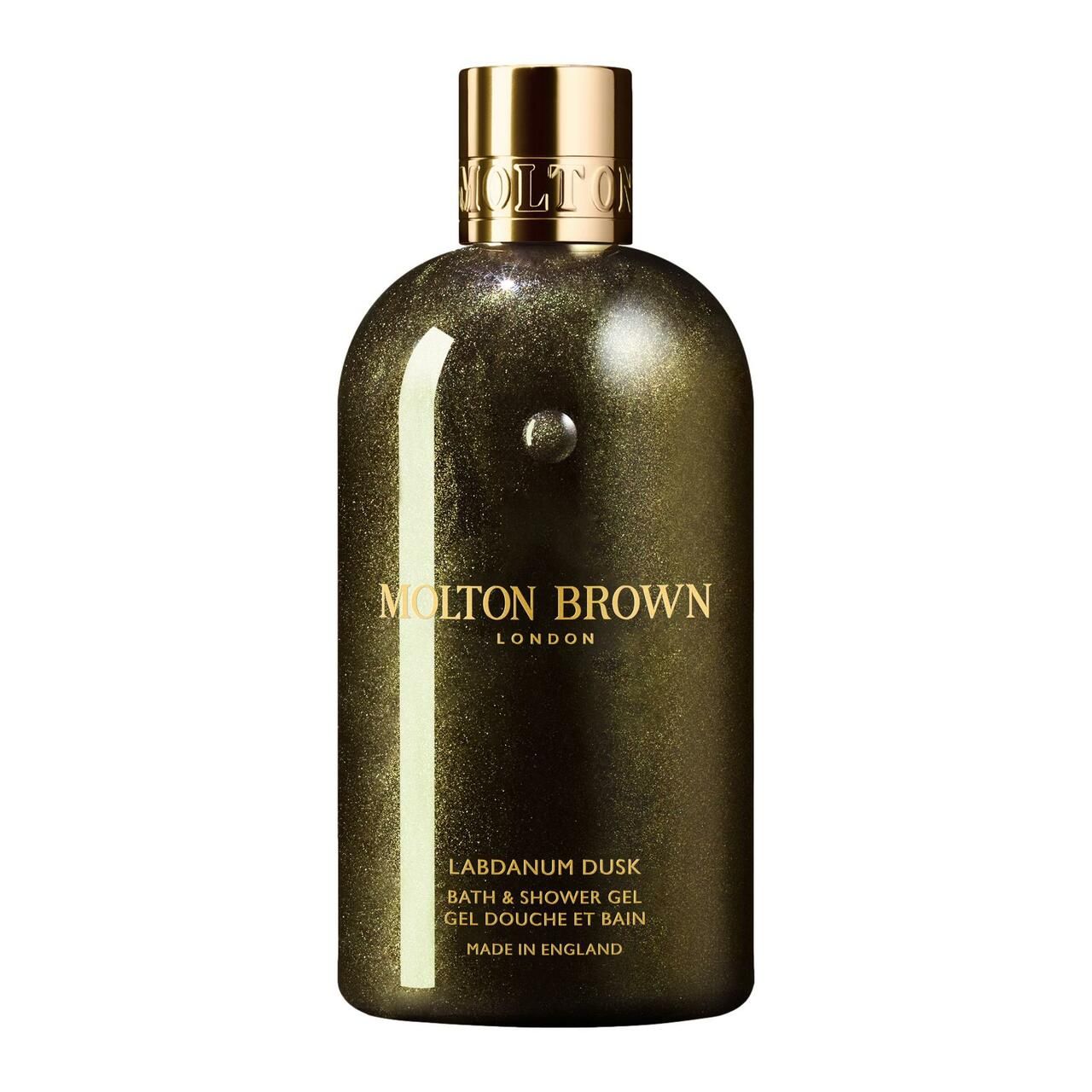 Duschgel-Flasche, goldfarben, mit goldenem Verschluss. Beschriftung: Molton Brown London, Labdanum Dusk, Bath & Shower Gel, Made in England.