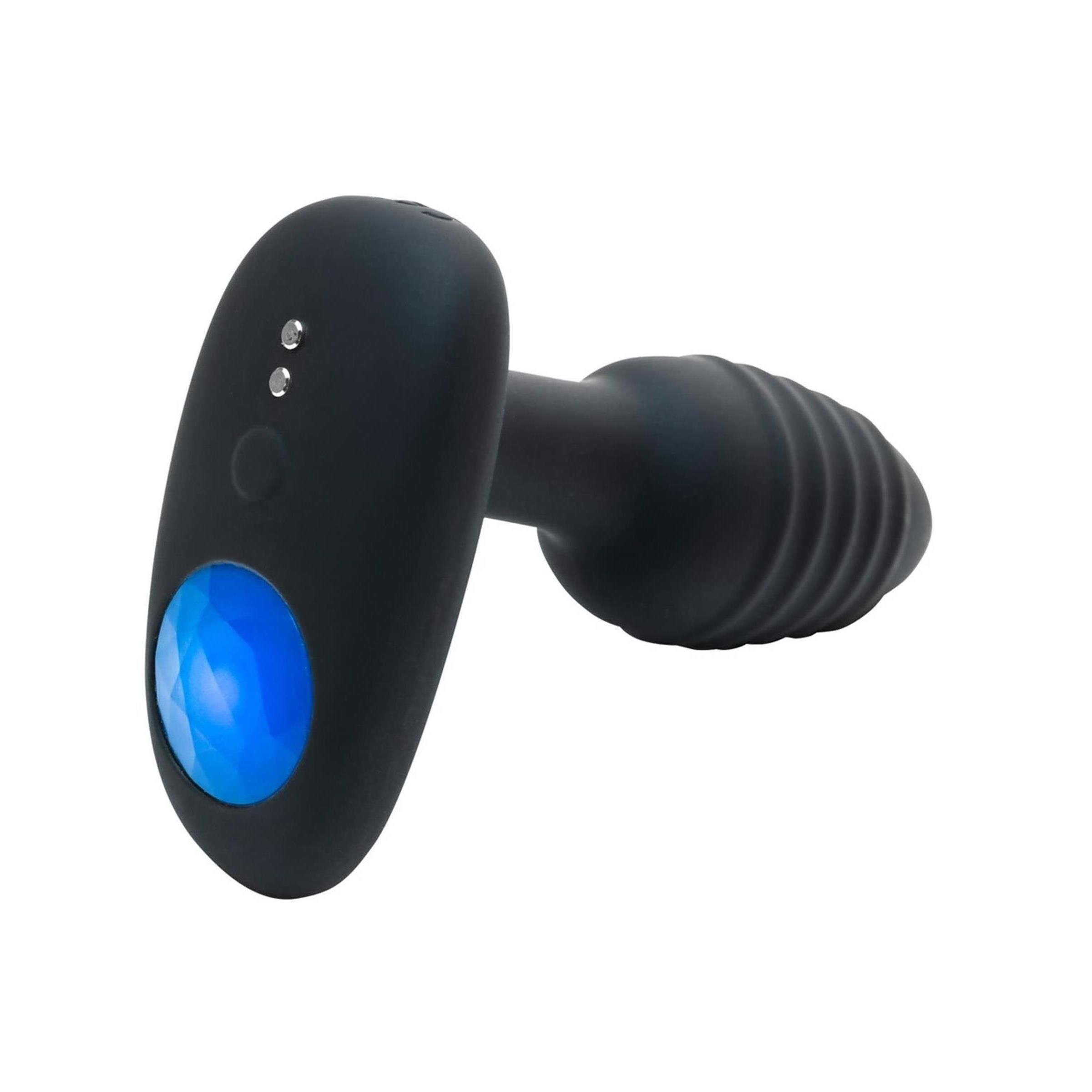 Schwarzes Wellness-Produkt mit geriffelter Spitze und ovalem Griff. Der Griff hat eine blaue Lichtanzeige.