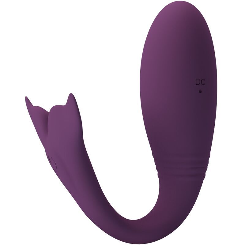 Lila Vibrator mit geschwungener Form und flossenartigem Ende. DC-Anschluss sichtbar. CE-Kennzeichnung.