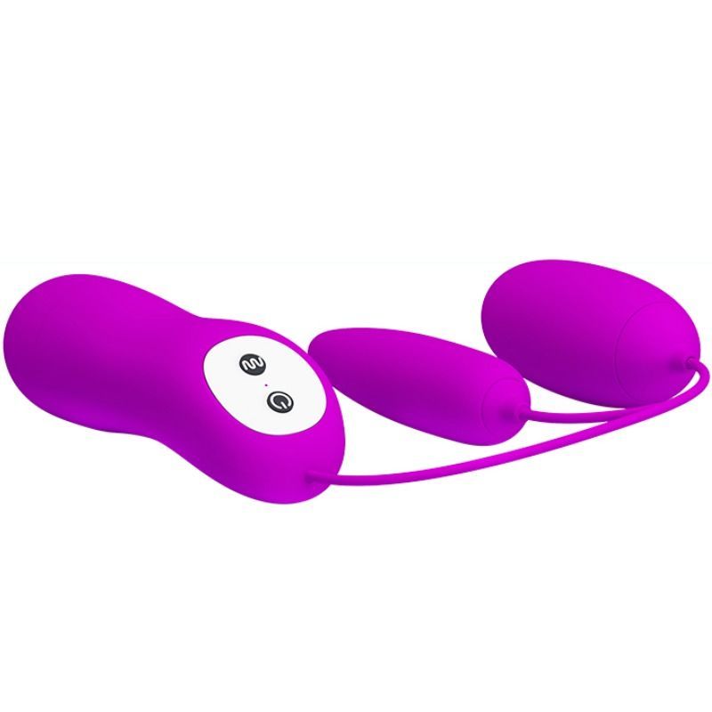 Lila Doppel-Vibrations-Ei mit Fernbedienung. Besteht aus drei Teilen, verbunden durch Kabel. Zwei Eier und ein Steuerteil mit Knöpfen.