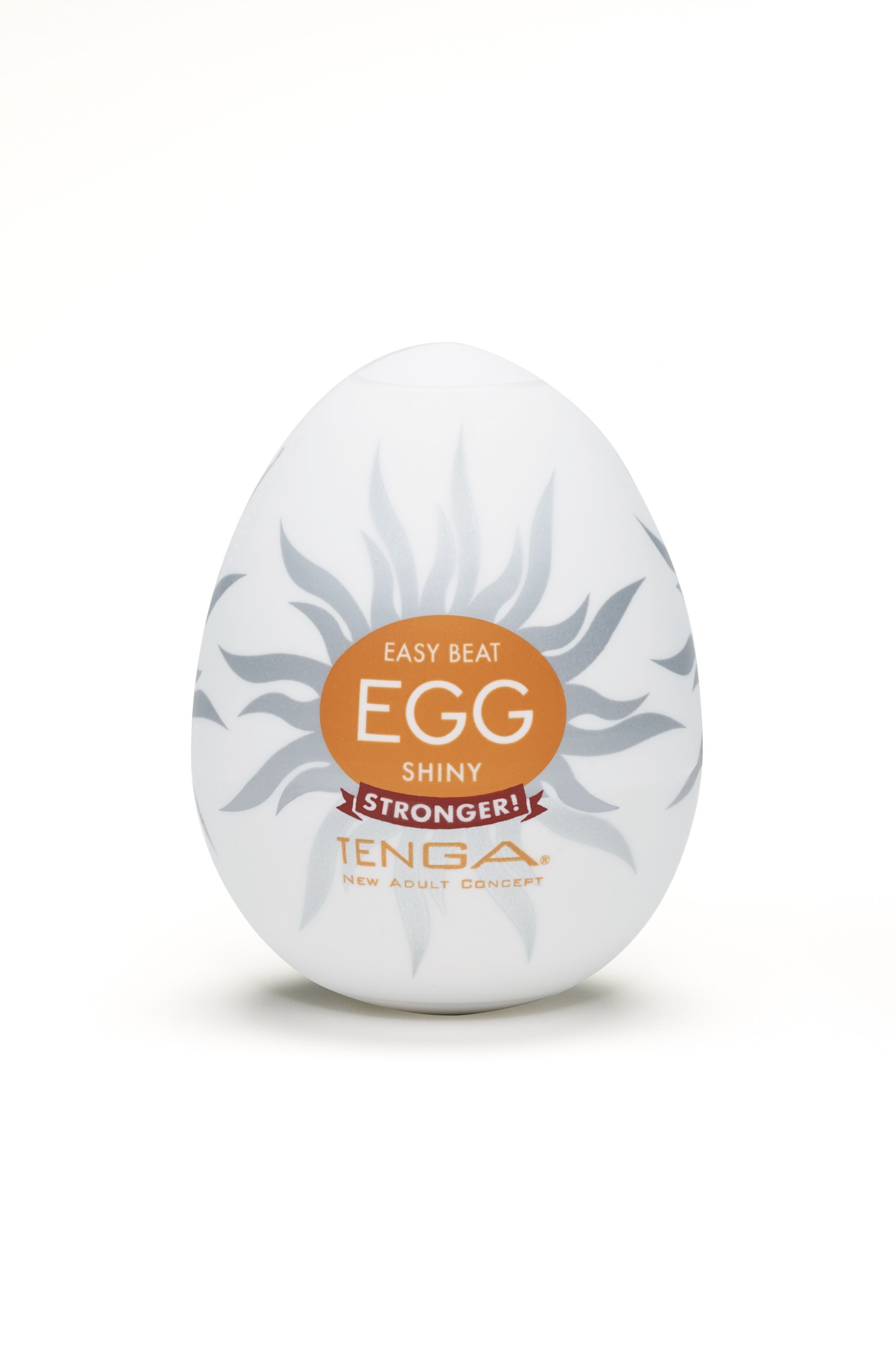 Weißes, eiförmiges Produkt. Auf der Verpackung steht "EASY BEAT EGG SHINY" und "TENGA".