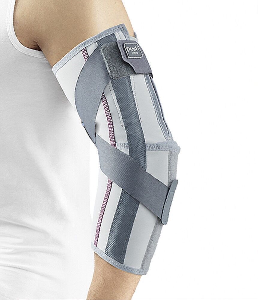 Ellenbogenbandage am Arm, weiß-grau mit Kreuzgurten. Klettverschluss mit Push-Logo. Person trägt weißes Shirt.