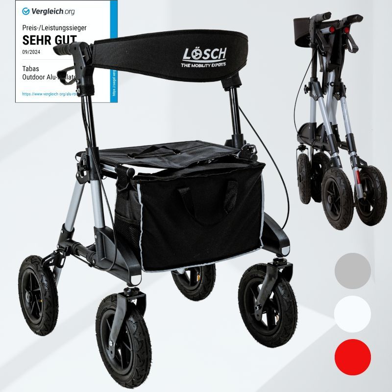 Rollator, silberfarbenes Gestell, schwarze Sitzfläche und Tasche. Marke LÖSCH. Vier Räder, zusammenklappbar.