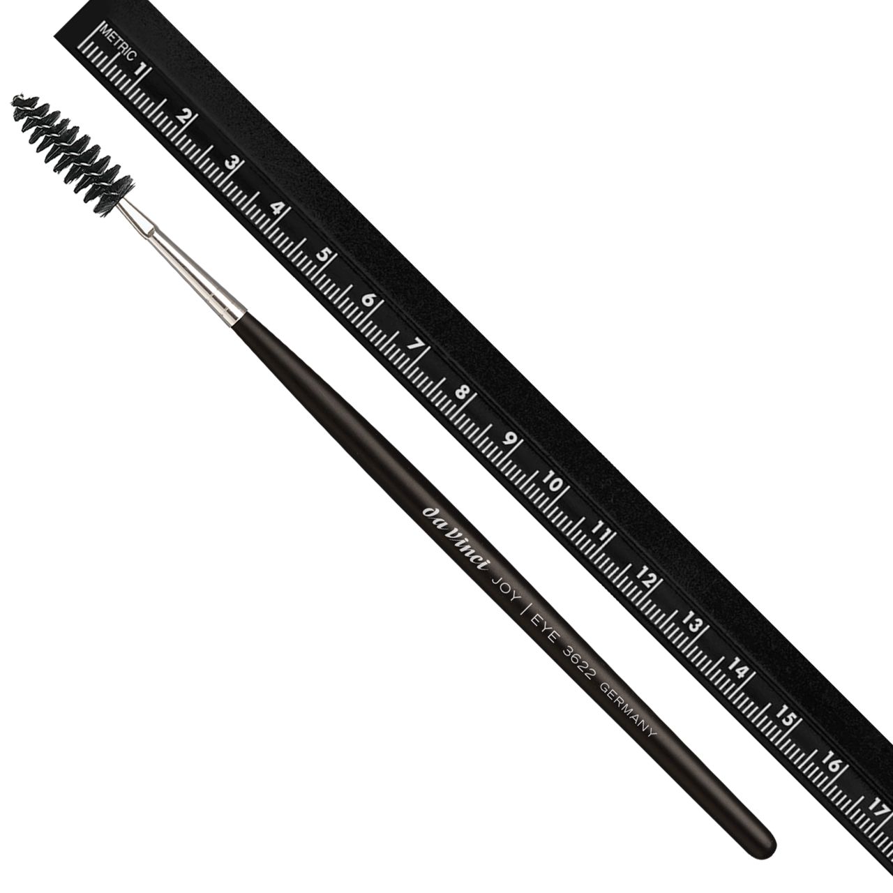 Wimpern-/Brauenbürstchen mit schwarzem Griff, Metallhülse und Bürstenkopf. Aufgedruckt: Da Vinci, Joy, Eye 3622 Germany. Neben Lineal.