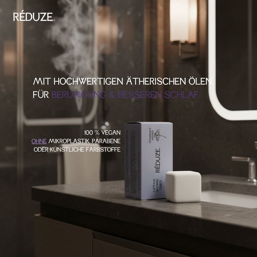 Eine Schachtel und ein Duschwürfel. Auf der Schachtel steht RÉDUZE. 100% vegan, ohne Mikroplastik.
