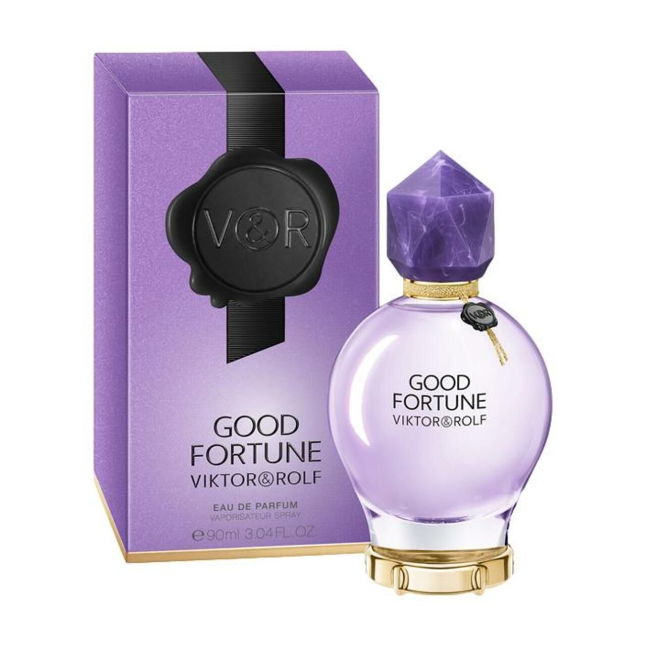 Violetter Flakon neben einer lila Schachtel. Kristallverschluss. Aufschrift: Good Fortune, Viktor & Rolf. Verpackung.