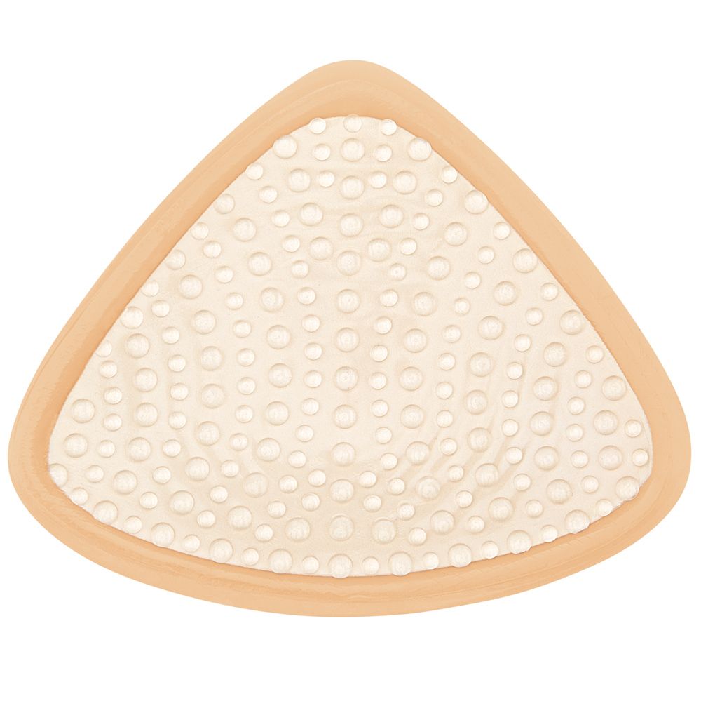 Rückseite einer Brustprothese mit wabenartiger Struktur aus kleinen Kreisen.