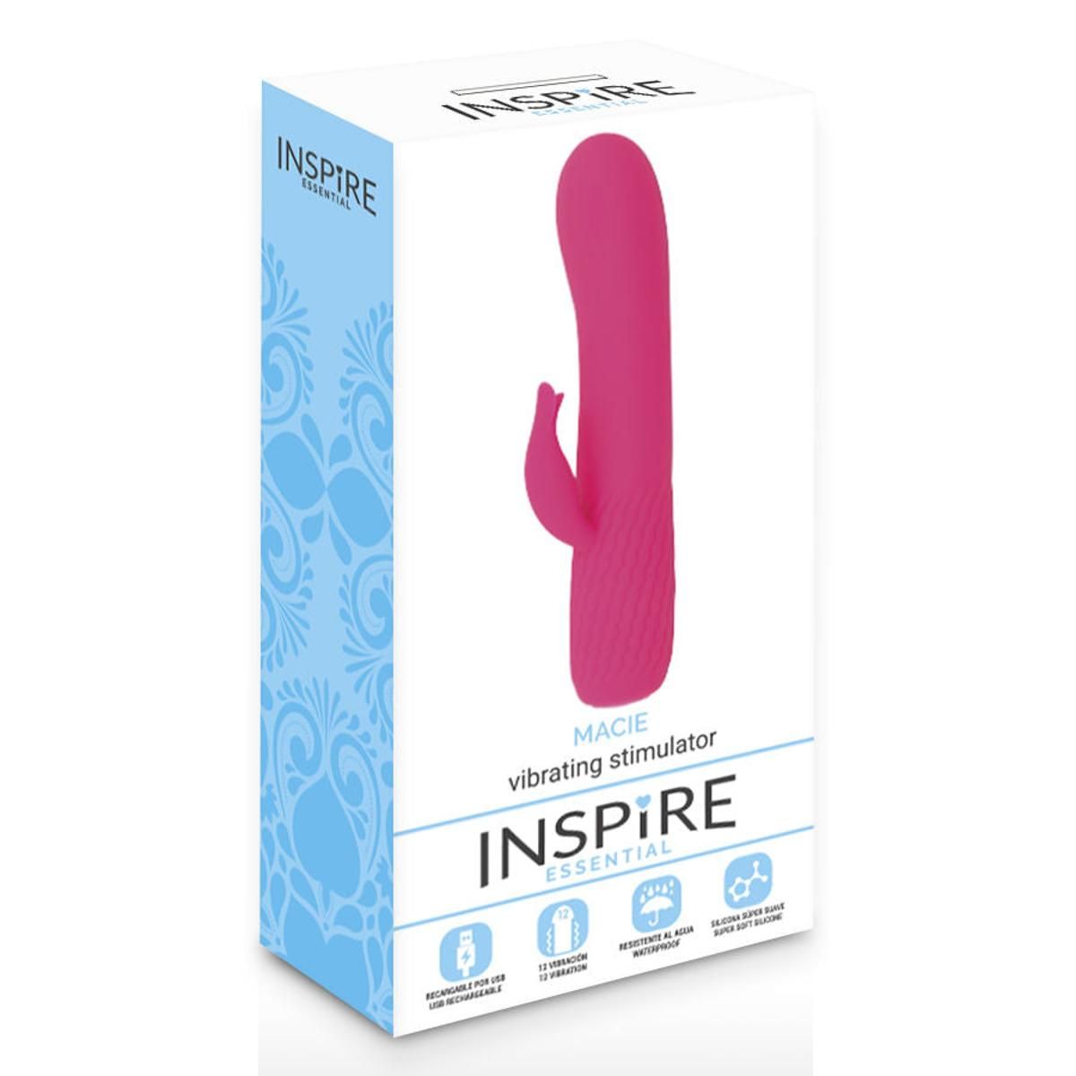 Verpackung mit rosa Vibrator. Text: "Macie vibrating stimulator" und "INSPIRE". Blaue Muster auf weißem Hintergrund.