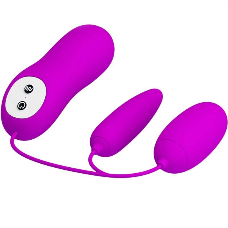 Lila Doppel-Vibrations-Ei mit Fernbedienung. Besteht aus drei Teilen, verbunden durch Kabel. Zwei Eier und ein Steuerteil mit Knöpfen.
