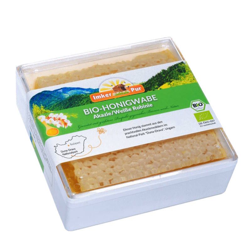 Bio-Honigwabe in transparenter Verpackung. Aufschrift: Bio-Honigwabe Akazie/Weiße Robinie. Mit Bio-Siegel.