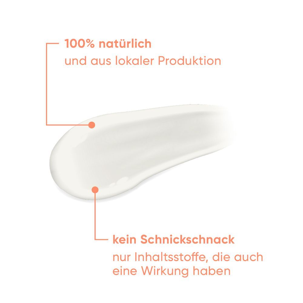 Weißer Creme-Strich mit Text. Text: 100% natürlich und aus lokaler Produktion, kein Schnickschnack.
