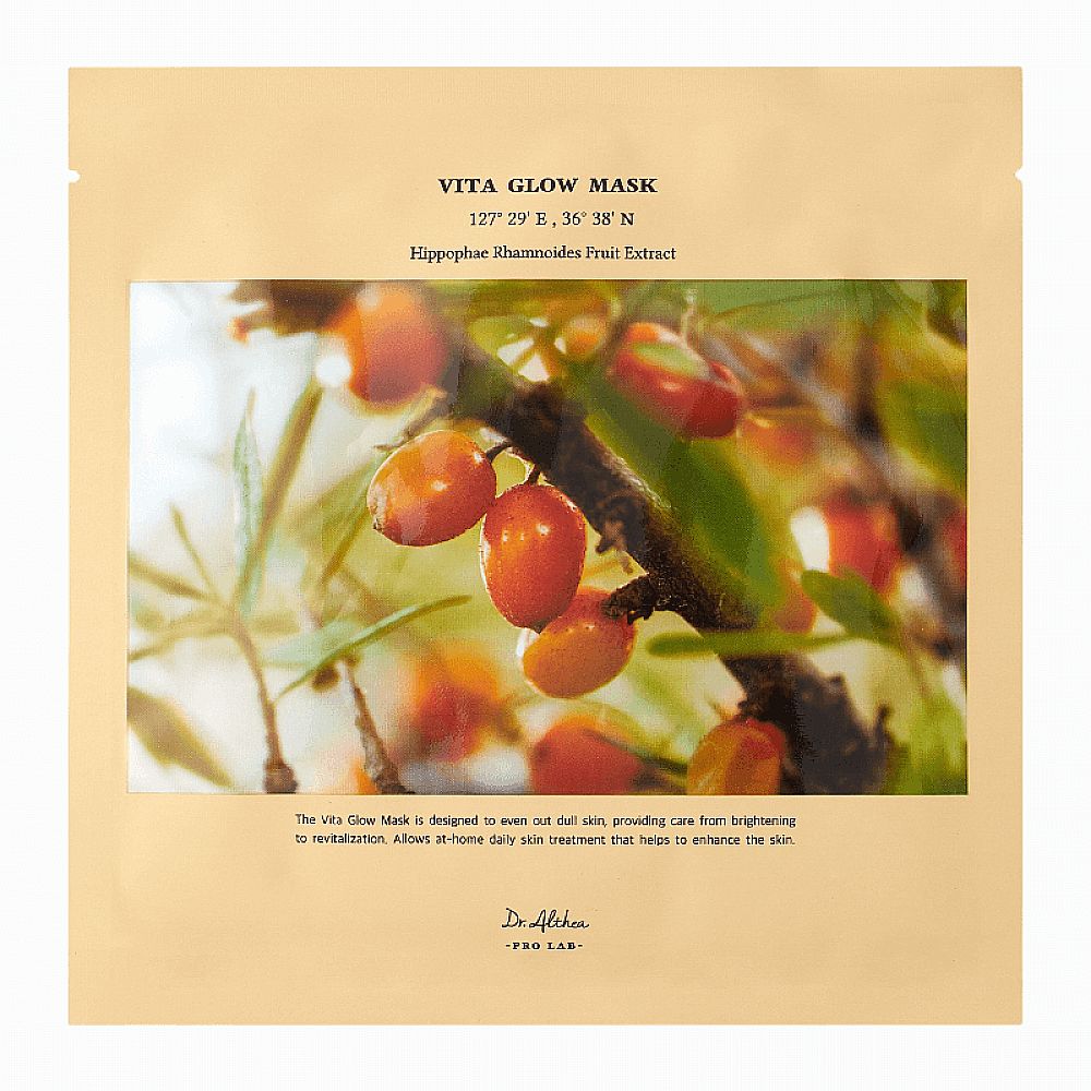 Gesichtsmaske in einer Verpackung. Aufdruck: VITA GLOW MASK, Hippophae Rhamnoides Fruit Extract. Abbildung von Beeren.