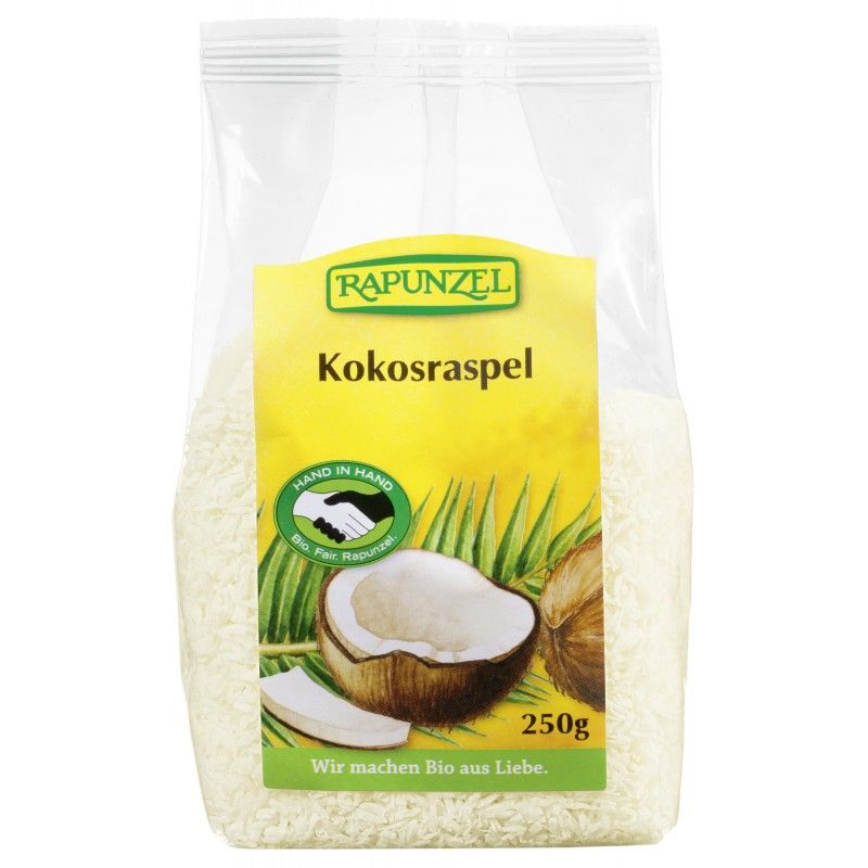 Transparente Tüte mit Kokosraspeln. Auf gelbem Etikett: Rapunzel, Kokosraspel, Hand in Hand-Siegel, Kokosnuss-Illustration, 250g.