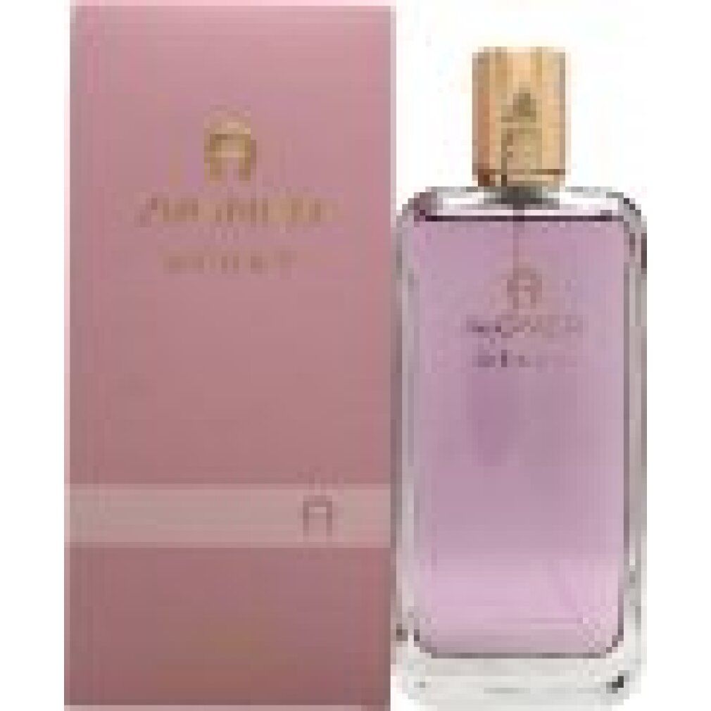 Rosa Flakon mit goldfarbenem Verschluss und rosa Verpackung. Aufschrift: AIGNER DÉBUT. Eau de Parfum.