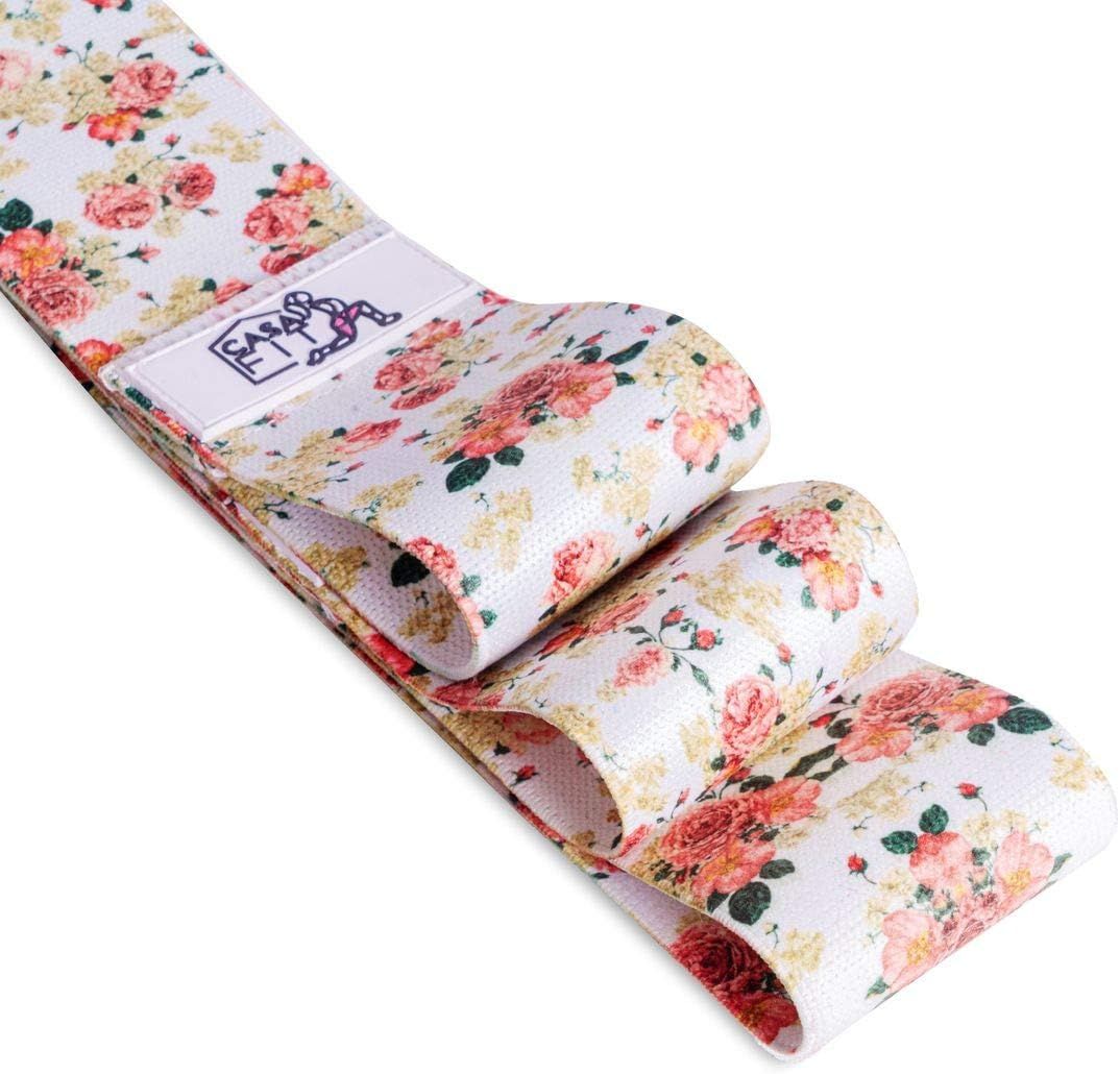 Hüftband mit floralem Muster. Weißer Grundton mit Rosen in Rosa- und Gelbtönen. Logo auf weißem Label. Gefaltet.