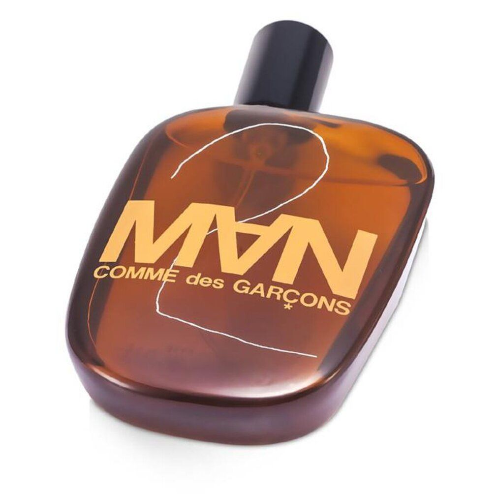 CDG 2 MAN Eau de Toilette Spray. Brauner Flakon mit schwarzem Verschluss. Logo und Schriftzug.