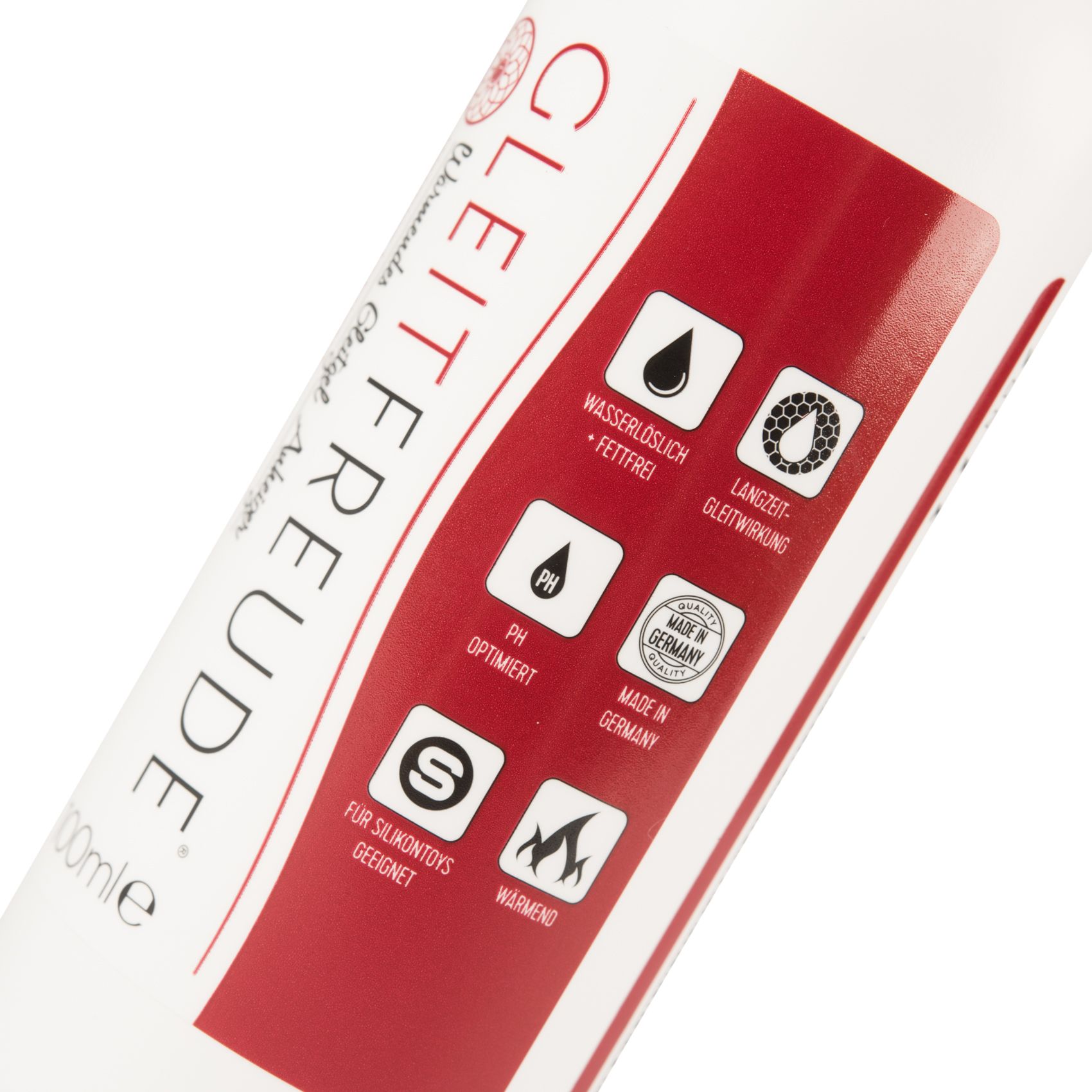 Nahaufnahme einer weißen Flasche mit roter Beschriftung. Text: Gleitfreude. Logos und Text: Wasserlöslich, fettfrei, pH-optimiert, Made in Germany.