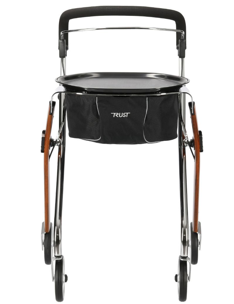 Rollator mit Holzoptik, schwarzem Korb und Tablett. Vier Räder, schwarze Griffe. Marke: TRUST.