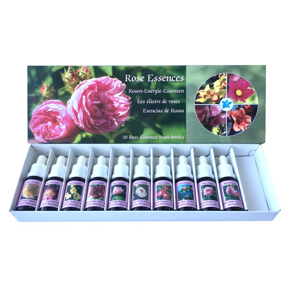 Set mit 10 Fläschchen Rosen-Essenzen in einer weißen Schachtel. Auf der Verpackung: Rosenblüten, Produktname und weitere Informationen.