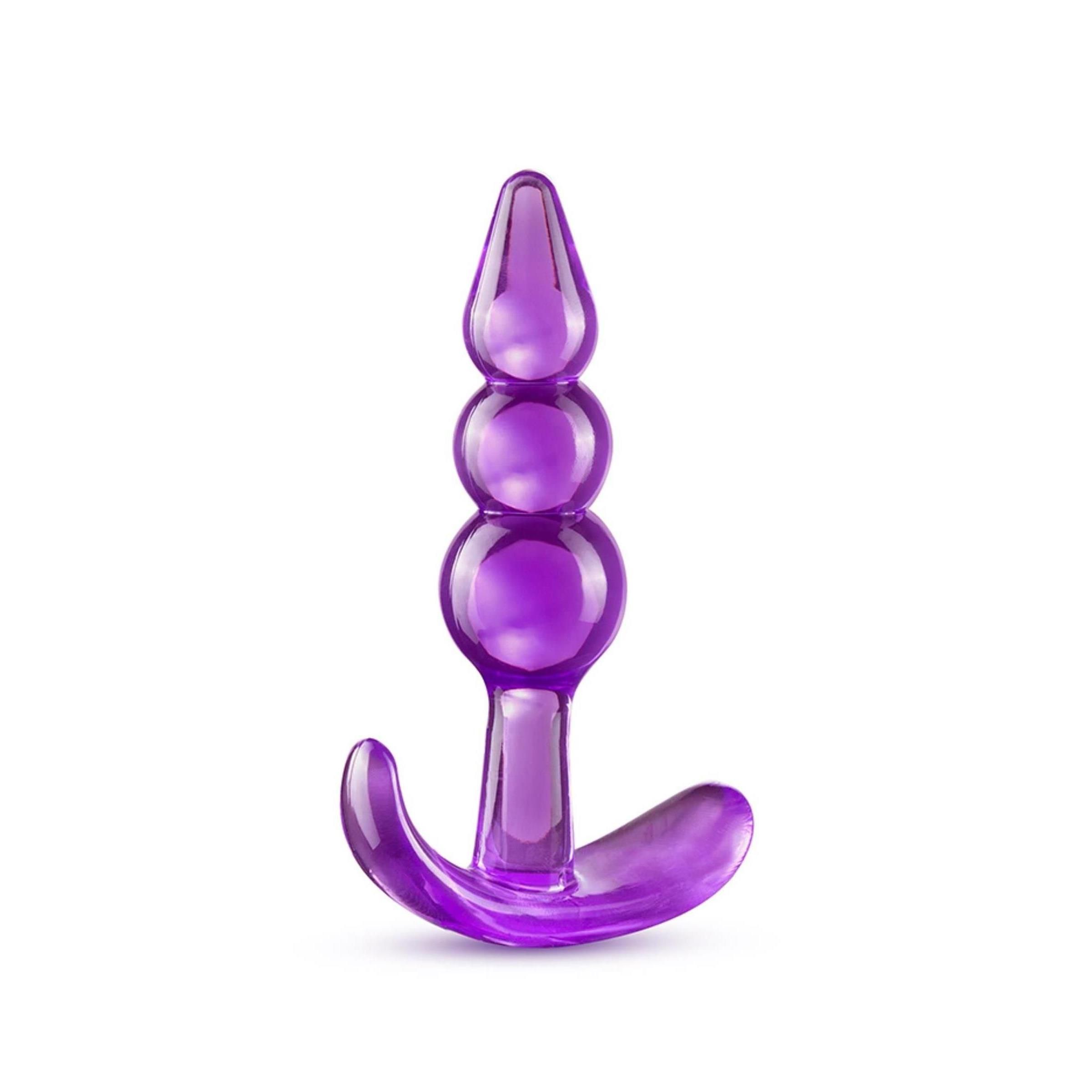 Lila Analplug mit drei Kugeln und gebogener Basis. Aus transparentem Material.