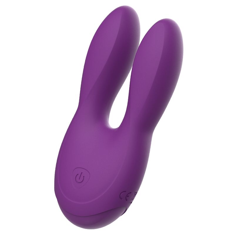 Lila Stimulator mit zwei Flügeln und abgerundeter Basis. Power-Symbol sichtbar.