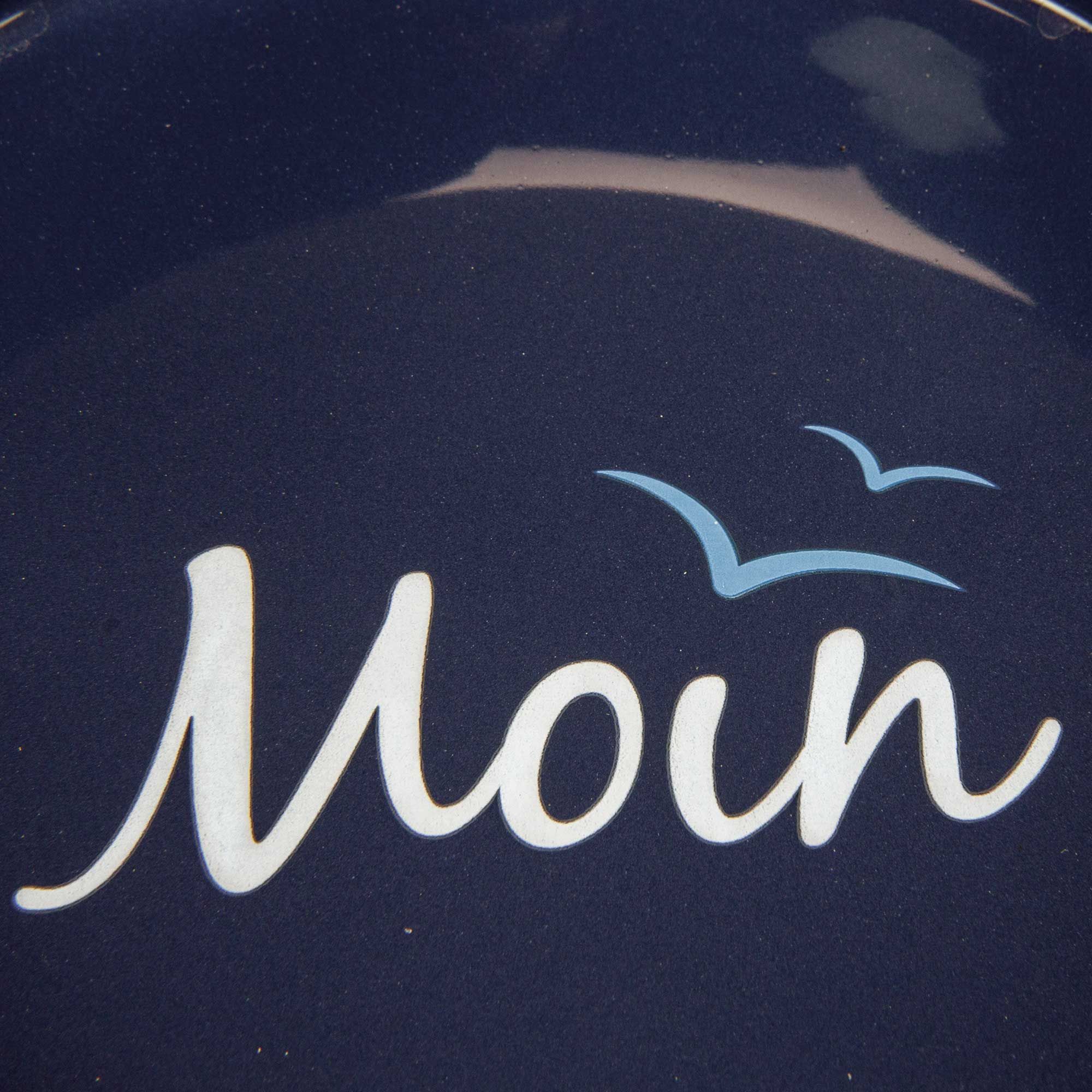 Nahaufnahme des blauen Napf-Inneren mit "Moin" Schriftzug und Möwen-Symbol.