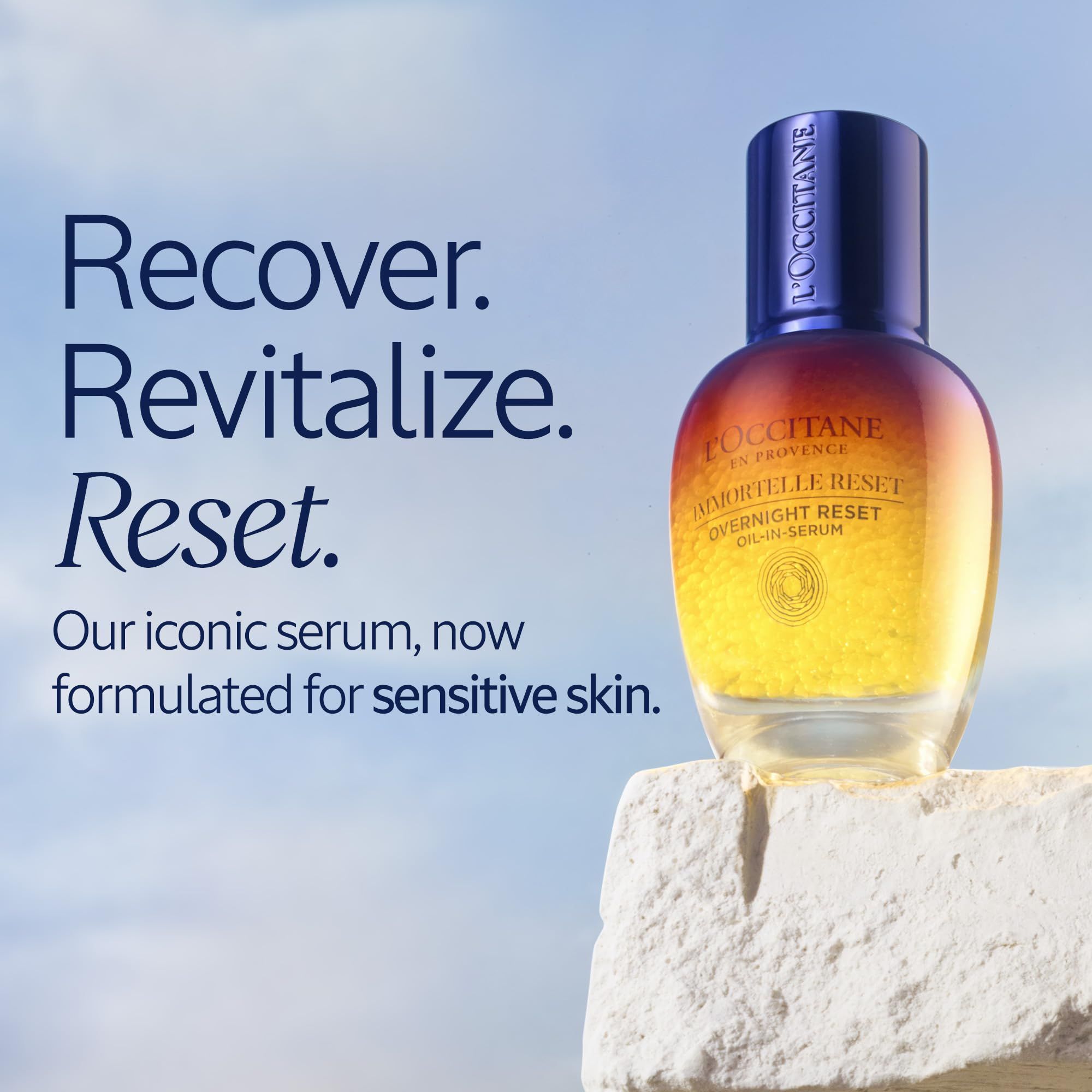 Serumflasche von L'Occitane. Farbverlauf von Blau nach Gelb. Text: Recover. Revitalize. Reset. Unser ikonisches Serum, jetzt für empfindliche Haut.