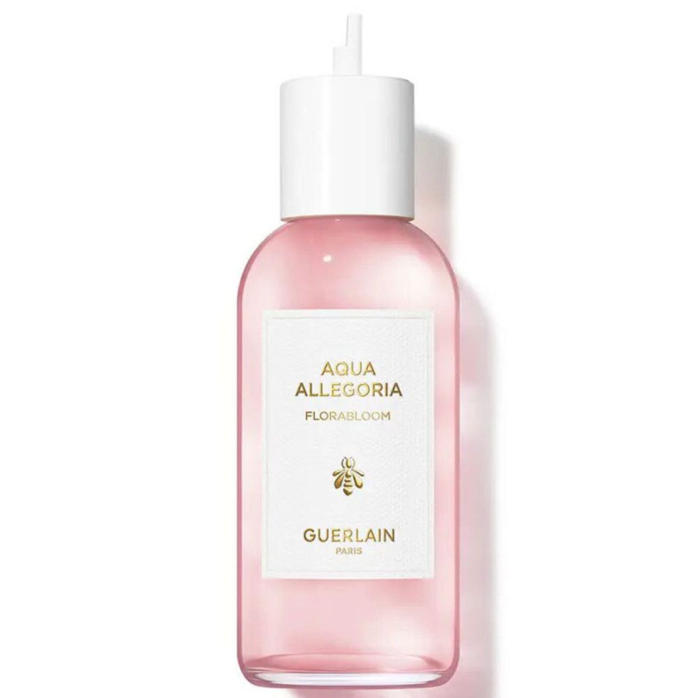 Rosa Flüssigkeit in einer Flasche mit weißem Verschluss. Aufkleber mit "Aqua Allegoria Florabloom" und "Guerlain".
