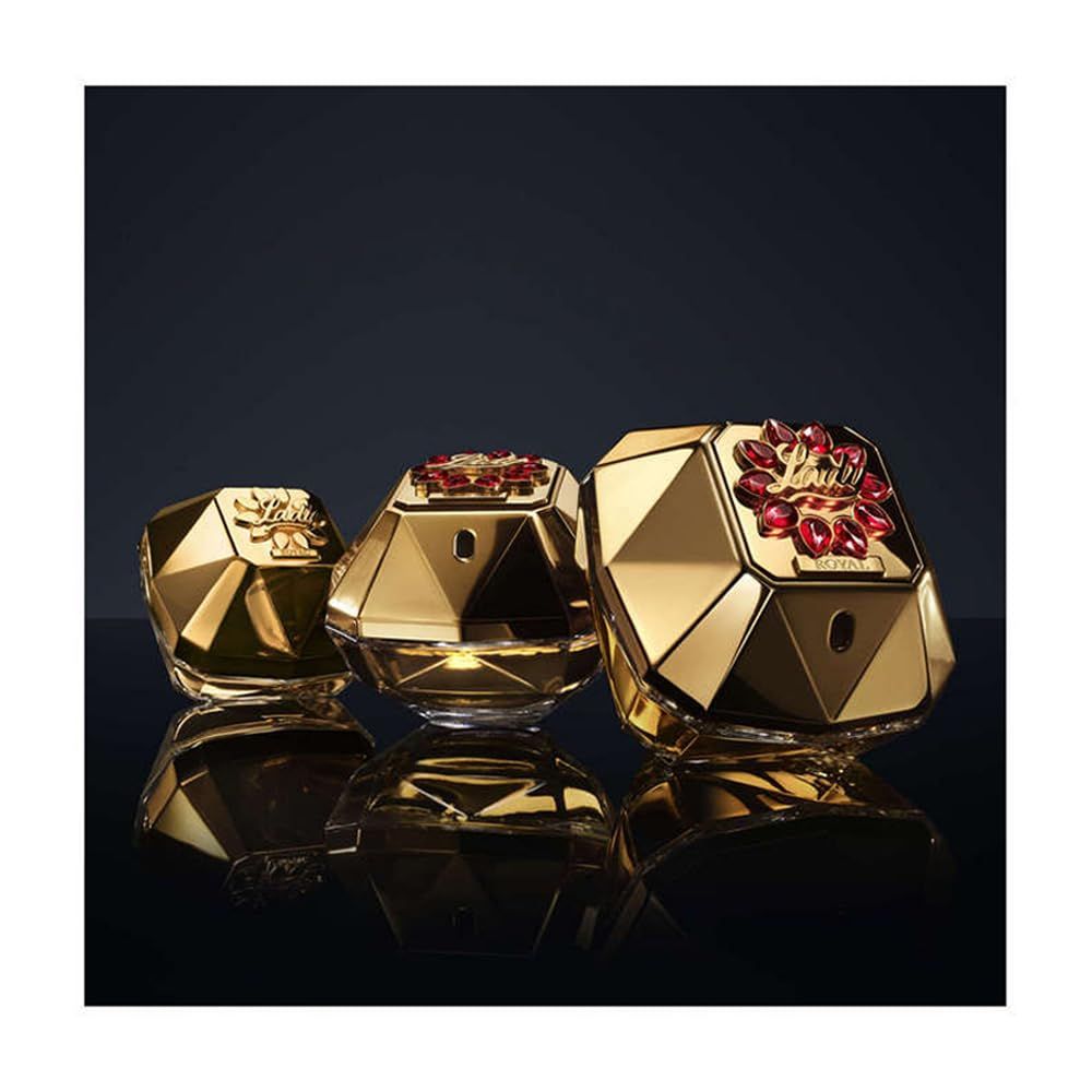 Drei goldfarbene Flakons. Der mittlere Flakon ist "Lady Million Royal".