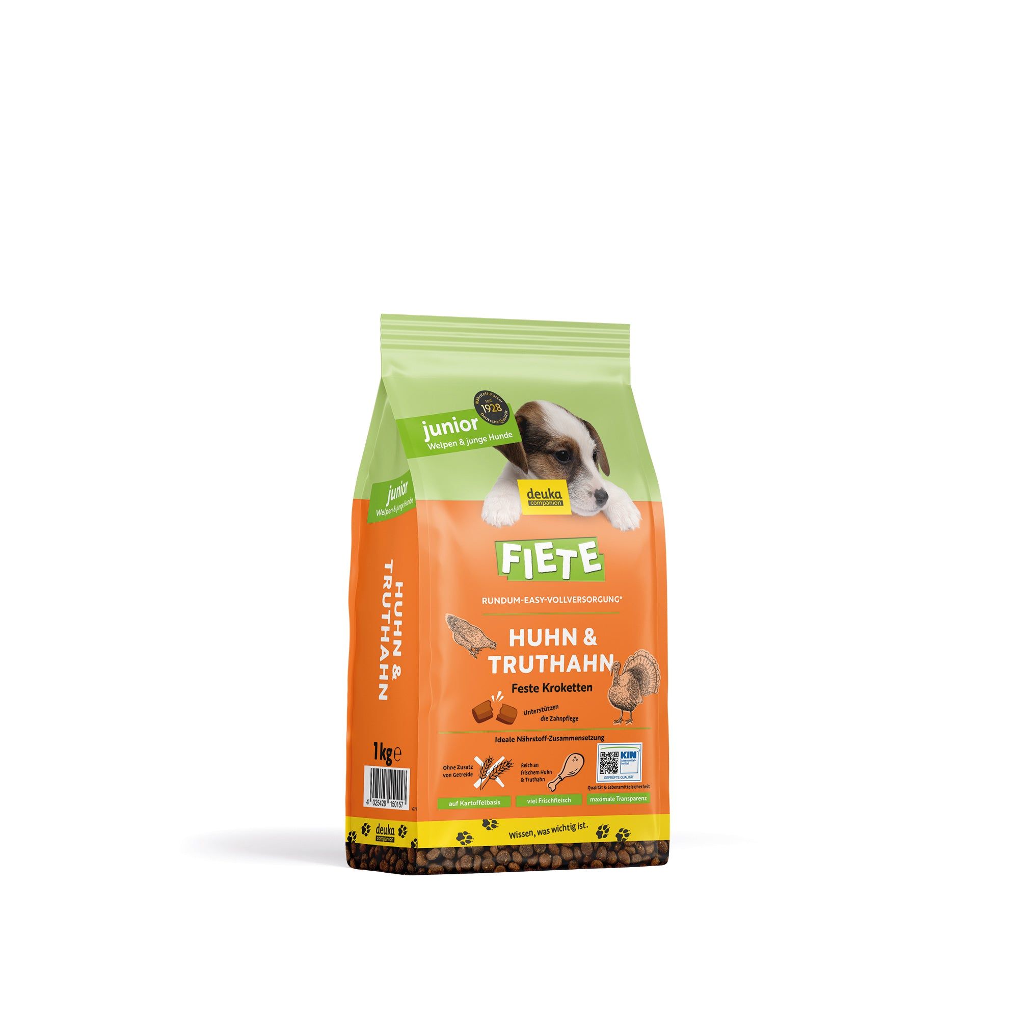 FIETE Junior Huhn & Truthahn Trockenfutter. Grün-orange Verpackung mit Welpen-Abbildung. Text: Huhn & Truthahn, Feste Kroketten.