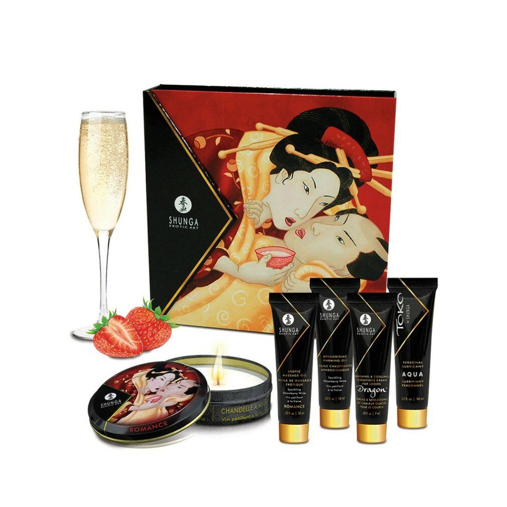 Geschenkset mit Cremes, Kerze, Dose, Erdbeeren und Sektglas. Geisha-Illustration auf der Verpackung. Schwarze Tuben.