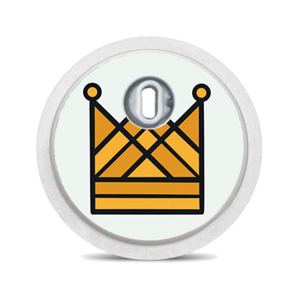 Runder Aufkleber mit gelber Krone auf hellgrünem Hintergrund. Oben ein silberfarbener Sensor.