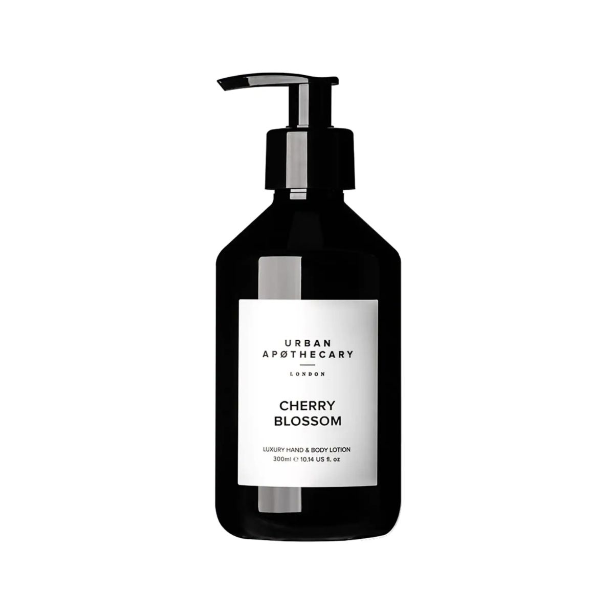Schwarze Flasche mit Pumpe. Etikett mit "Urban Apothecary London" und "Cherry Blossom". Luxus Hand- & Bodylotion.