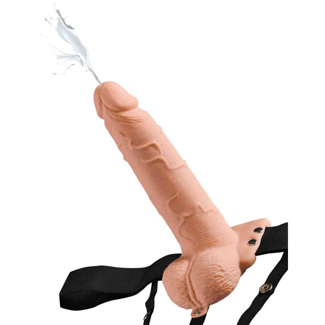 Beigefarbener Dildo mit Spritzfunktion und schwarzem Harness. Detailreiche Oberfläche, Spritzeffekt.