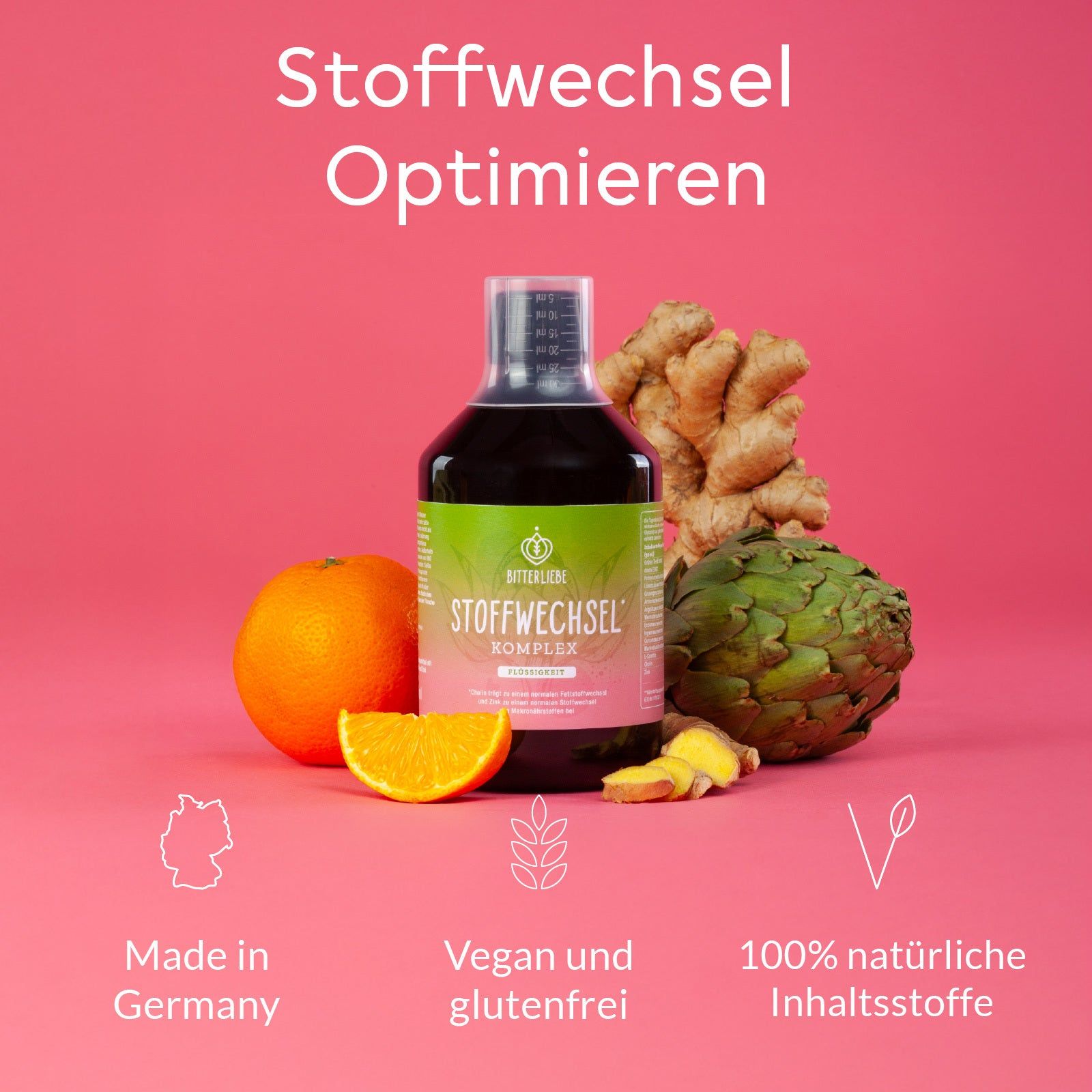 Flasche BitterLiebe Stoffwechsel Komplex. Grün-rosa Etikett. Orange, Artischocke, Ingwer. Text: Made in Germany, vegan.