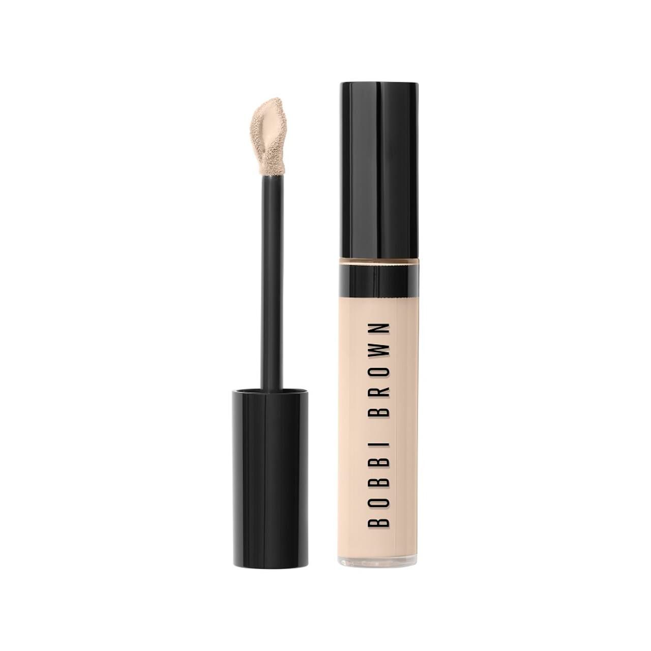 Bobbi Brown Skin Full Cover Concealer. Beige Tube mit schwarzem Deckel und Applikator. Produktname vertikal auf dem Tube.