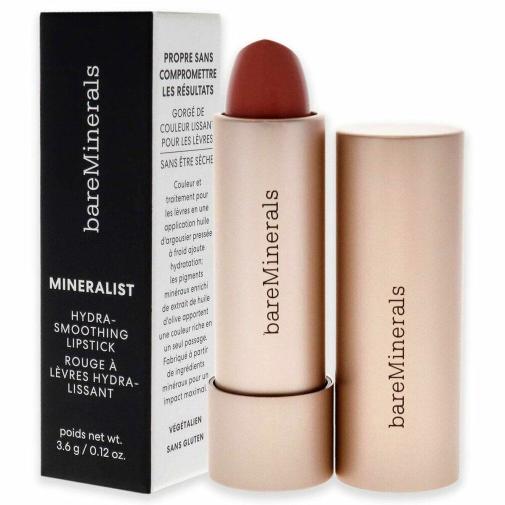 Lippenstift in Goldhülse, neben Verpackung. Marke: bareMinerals, Produktname: Mineralist Hydra-Smoothing Lipstick. Vegan.