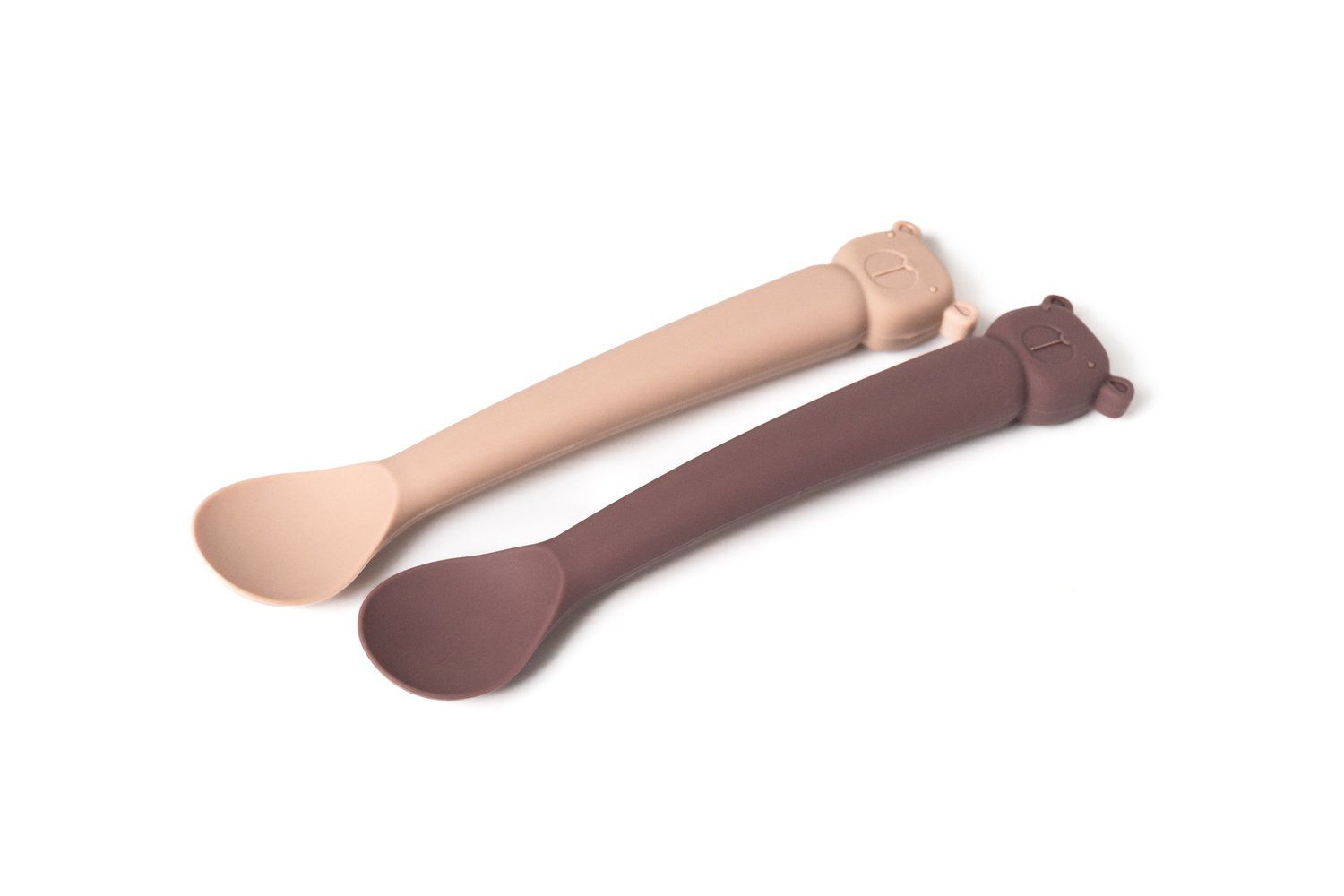 Zwei Löffel, beige und braun. Silikon, mit Bärenkopf-Design am Griffende.