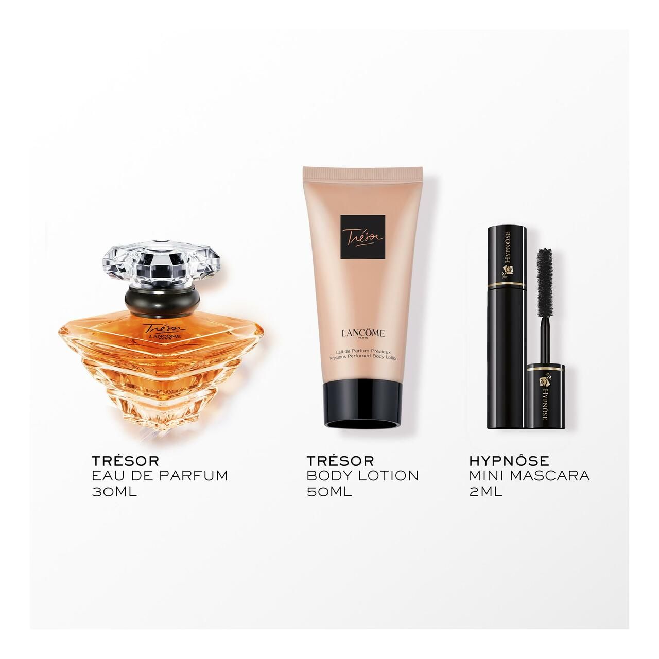 Parfumflakon, Körperlotion und Mascara. Aufschrift 'Trésor Eau de Parfum', 'Trésor Body Lotion' und 'Hypnôse Mini Mascara'.