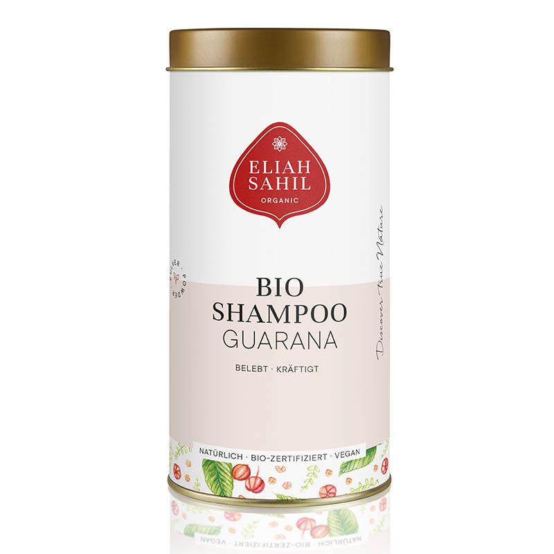 Zylindrische Dose mit goldfarbenem Deckel. Aufschrift: Eliah Sahil Organic, Bio Shampoo Guarana. Zertifizierungen: natürlich, bio-zertifiziert, vegan.