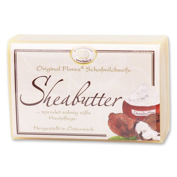 Rechteckige Seife mit Etikett: Original Florex Schafmilchseife Sheabutter. Illustration von Shea Butter.