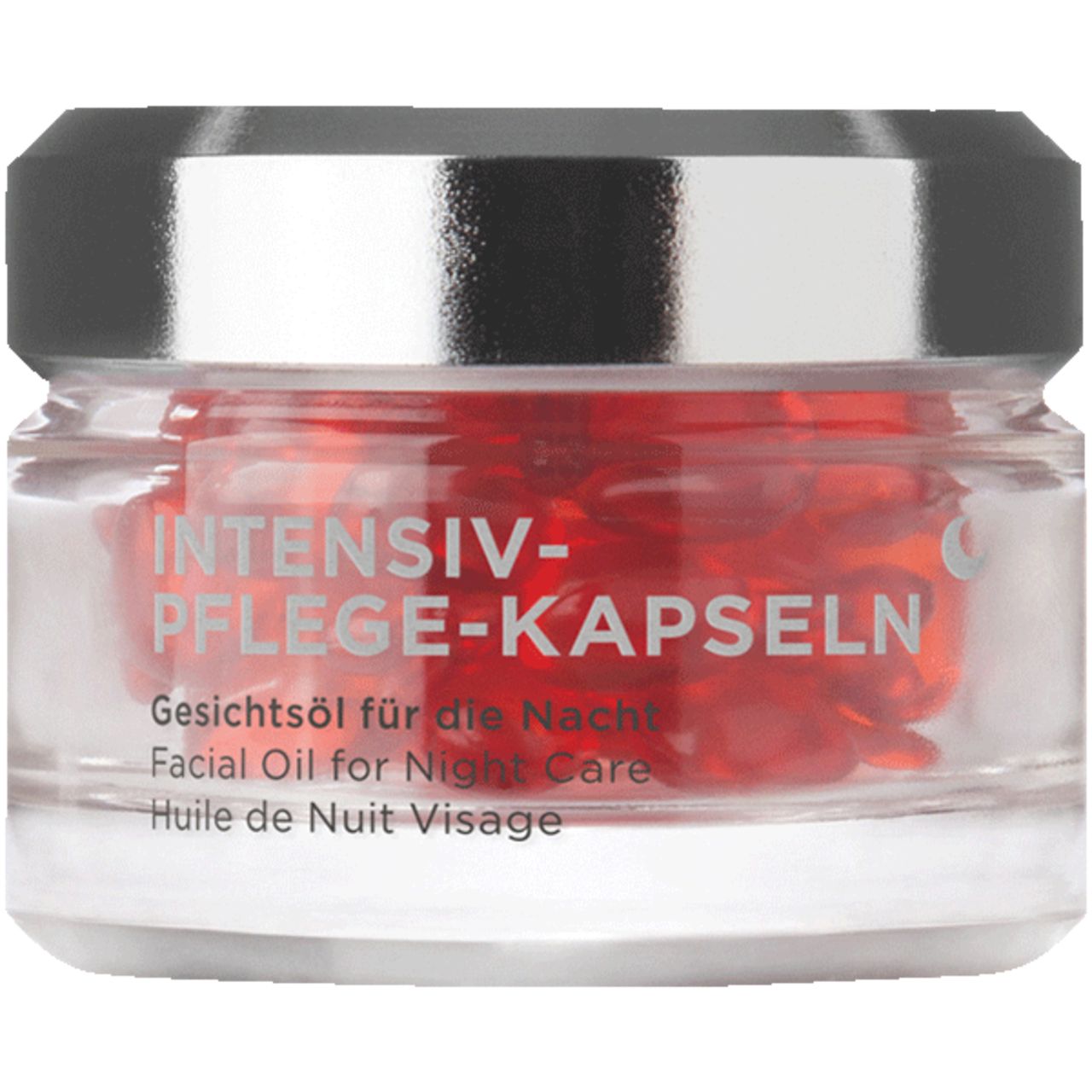 Glasbehälter mit roten Kapseln. Aufschrift: INTENSIV-PFLEGE-KAPSELN. Gesichtsol für die Nacht.