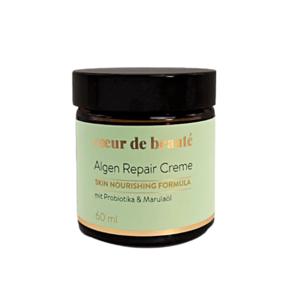Creme-Glas mit schwarzem Deckel. Aufschrift: Coeur de Beauté, Algen Repair Creme, Skin Nourishing Formula, mit Probiotika & Marulaöl. 60 ml.