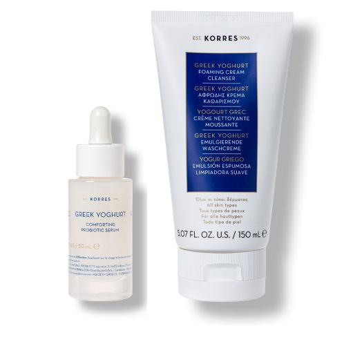 Zwei weiße Kosmetikprodukte. Links: Serumflasche mit Pipette. Rechts: Tube mit Aufschrift 'Greek Yoghurt'.