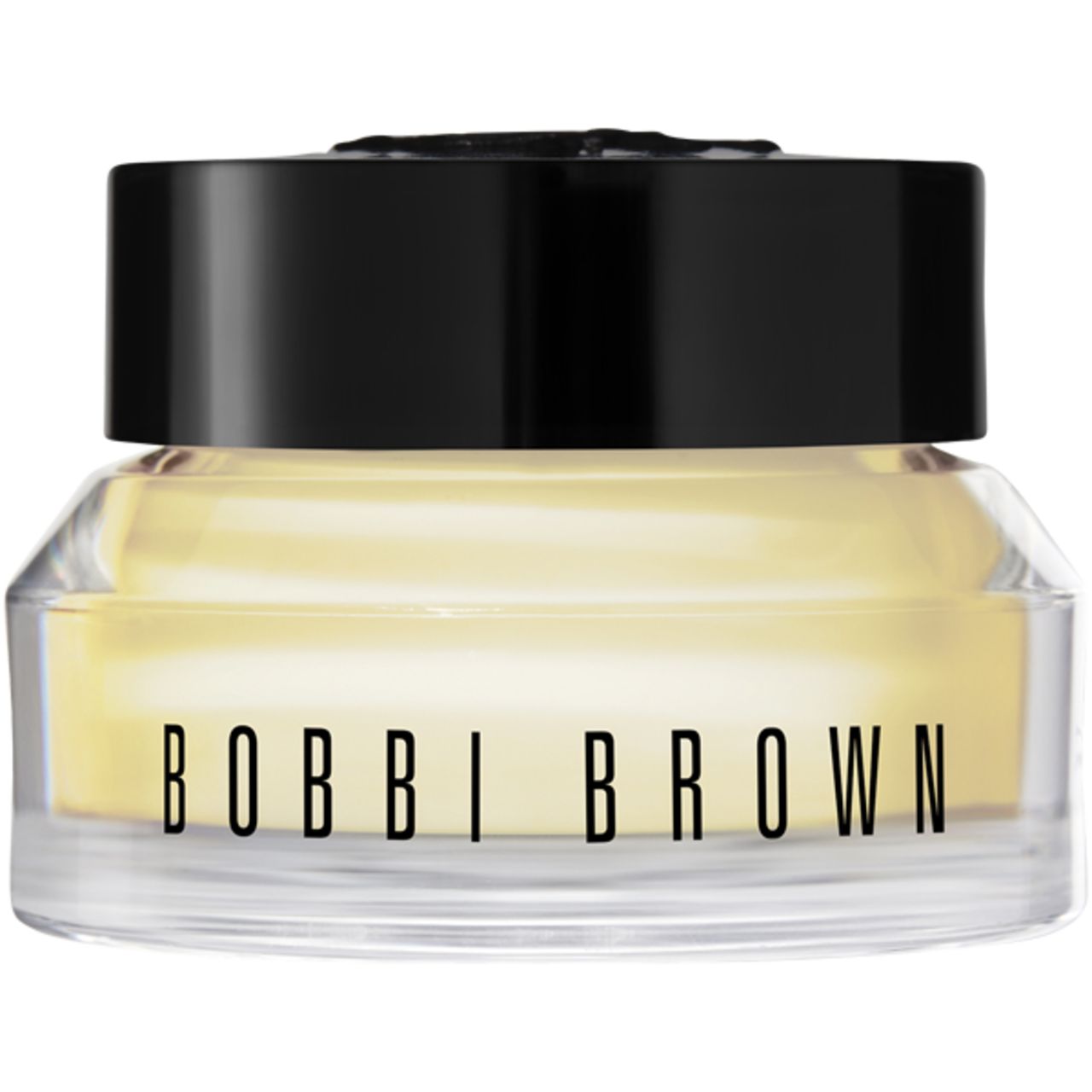Glasbehälter mit schwarzem Deckel. Aufschrift BOBBI BROWN. Gelbliche Creme sichtbar.