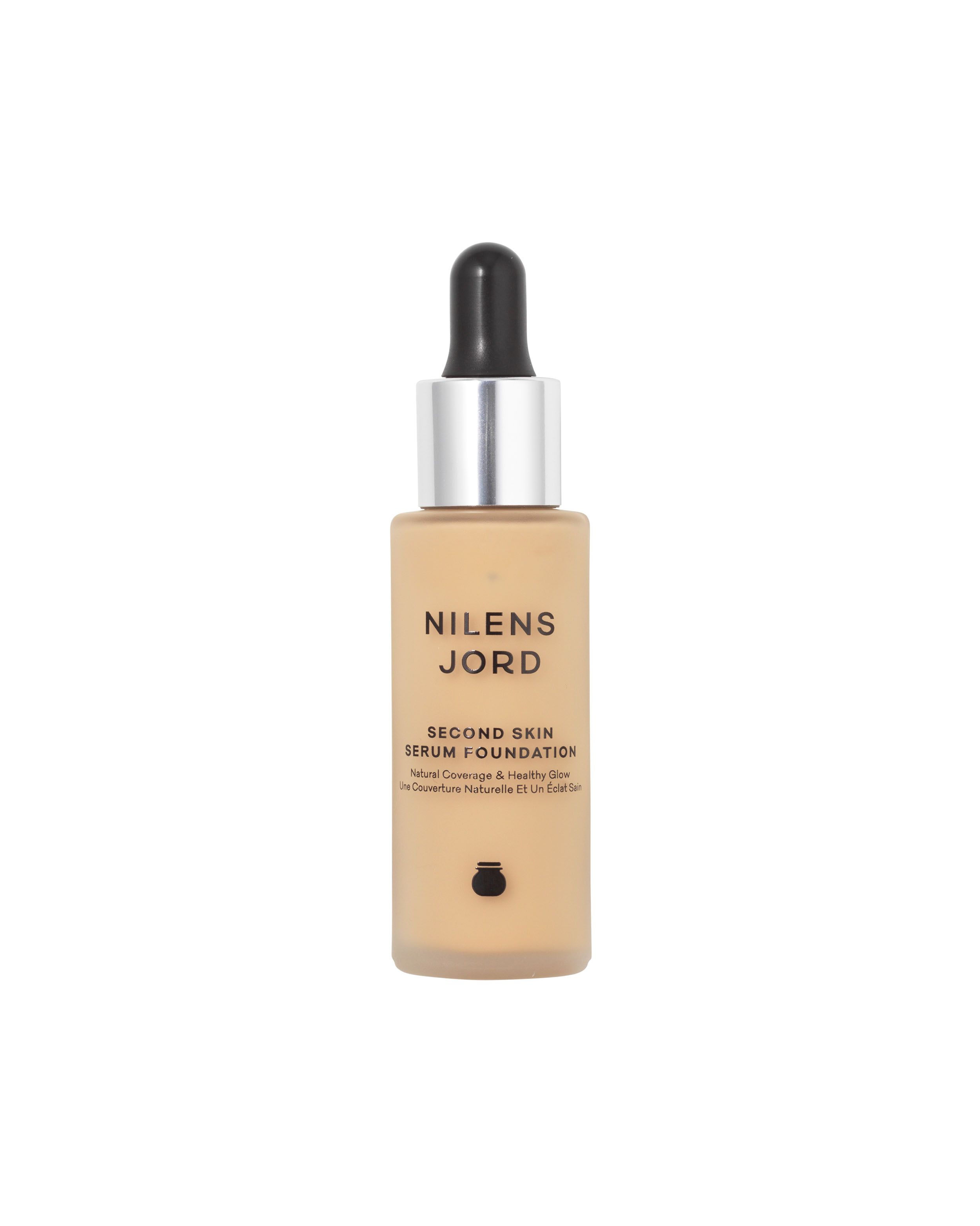 Nilens Jord Second Skin Serum Foundation in einem Glasfläschchen mit Pipette. Helle Hautfarbe.