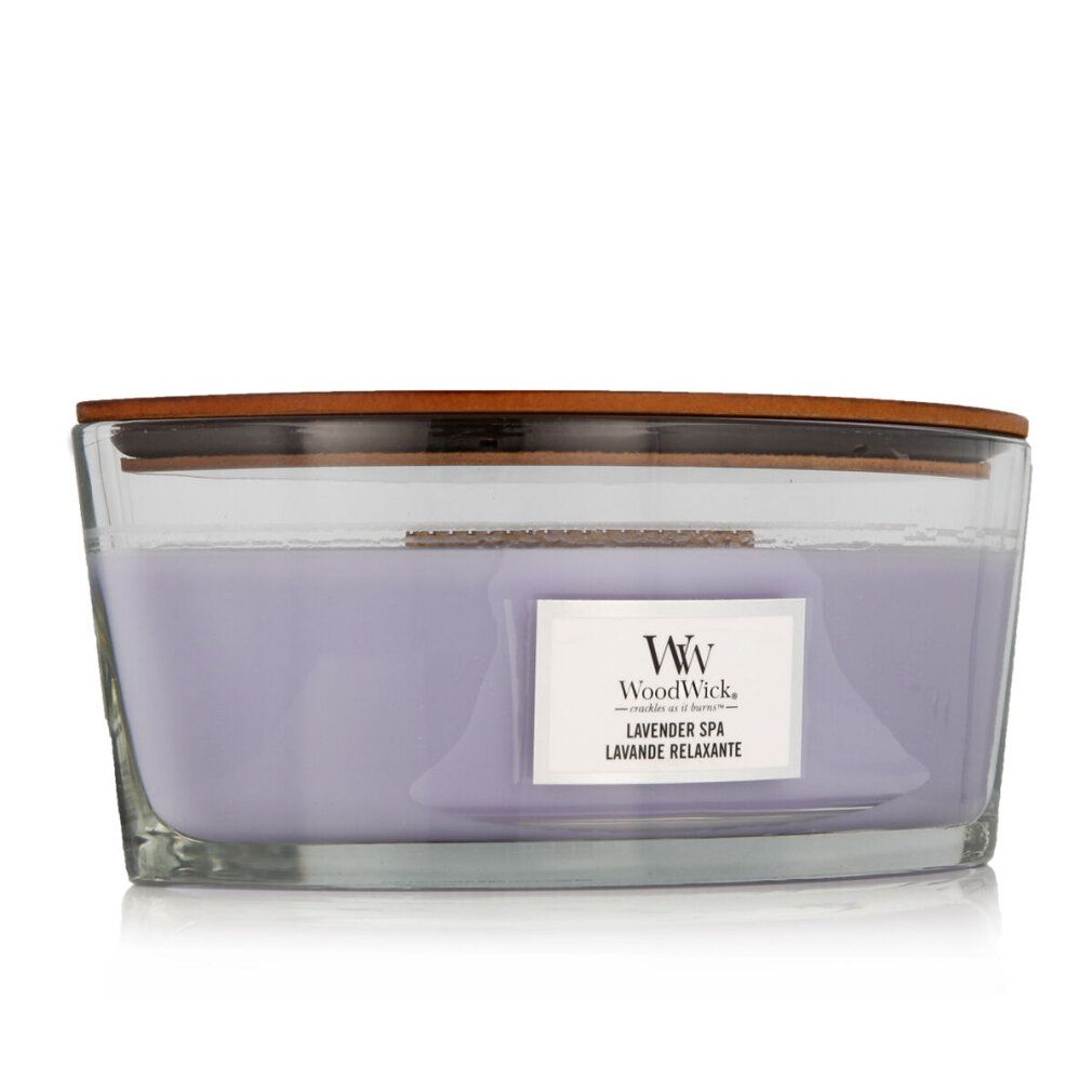 Ellipsenförmige Kerze mit Holzdeckel. Lila Wachs in Glasbehälter. Aufschrift: WoodWick, Lavender Spa, Lavande Relaxante.