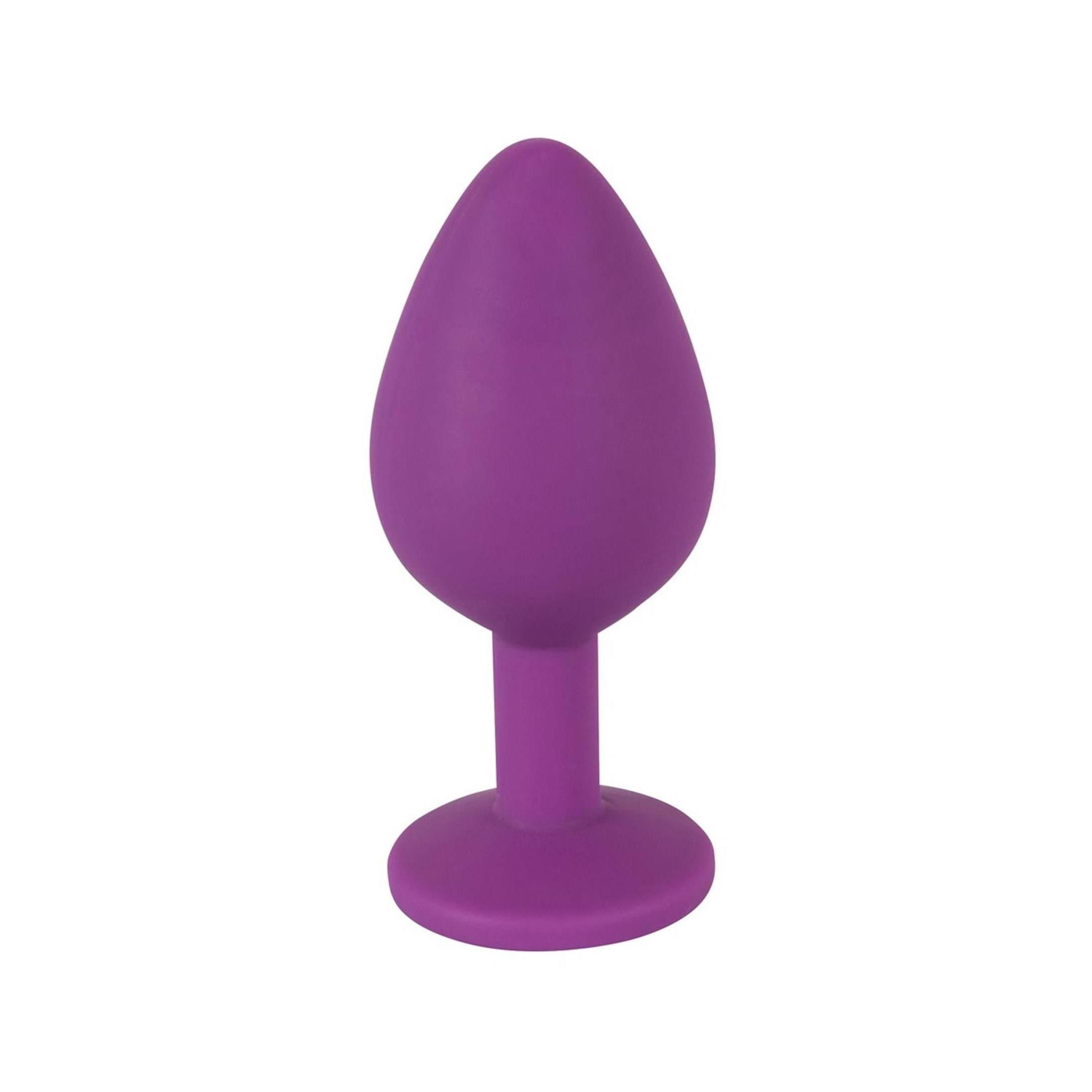 Lila Plug. Konische Form, runde Basis. Aufrecht stehend.