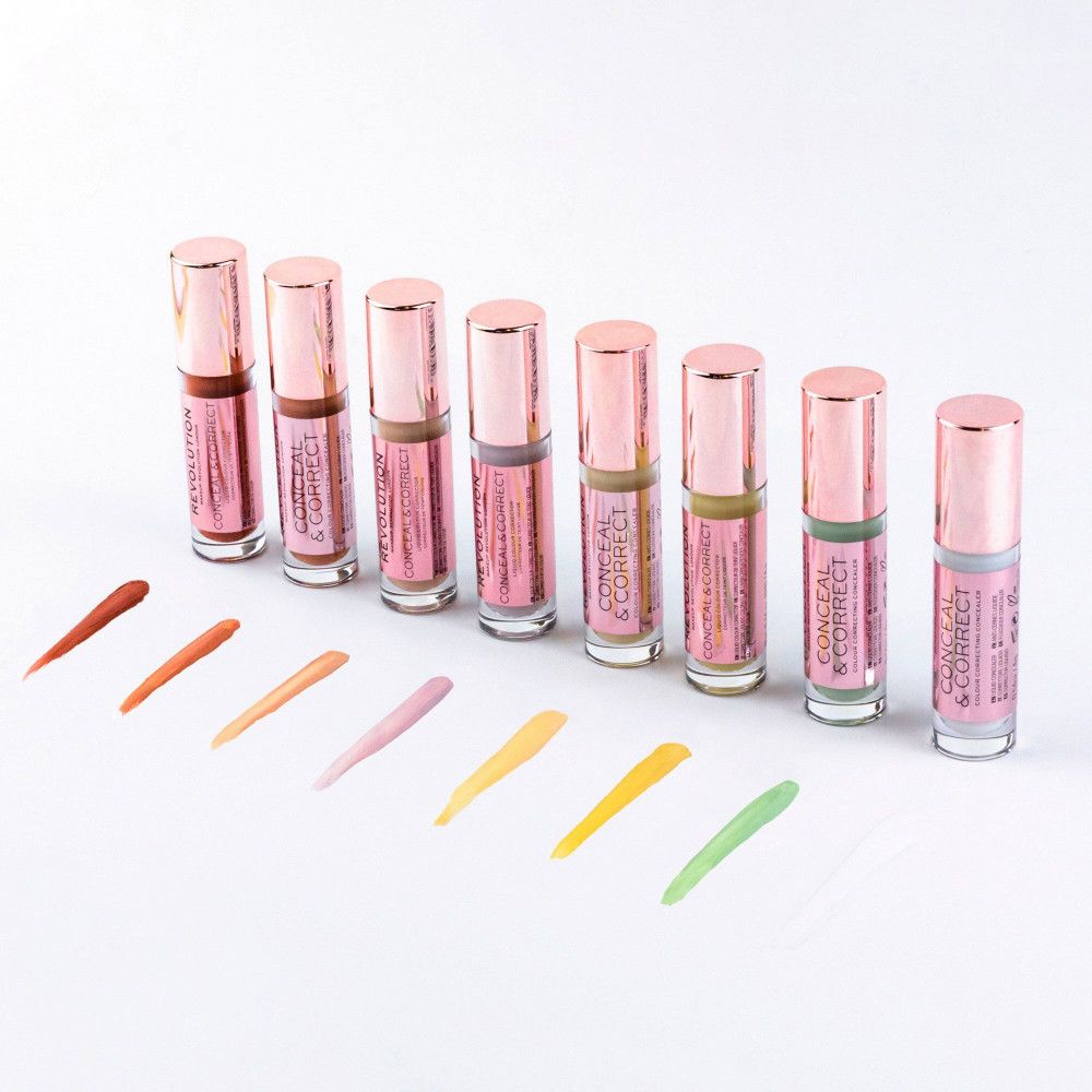 Reihe von Concealer-Fläschchen mit Farbtupfern. Rosa-goldene Verpackung, verschiedene Farbtöne.