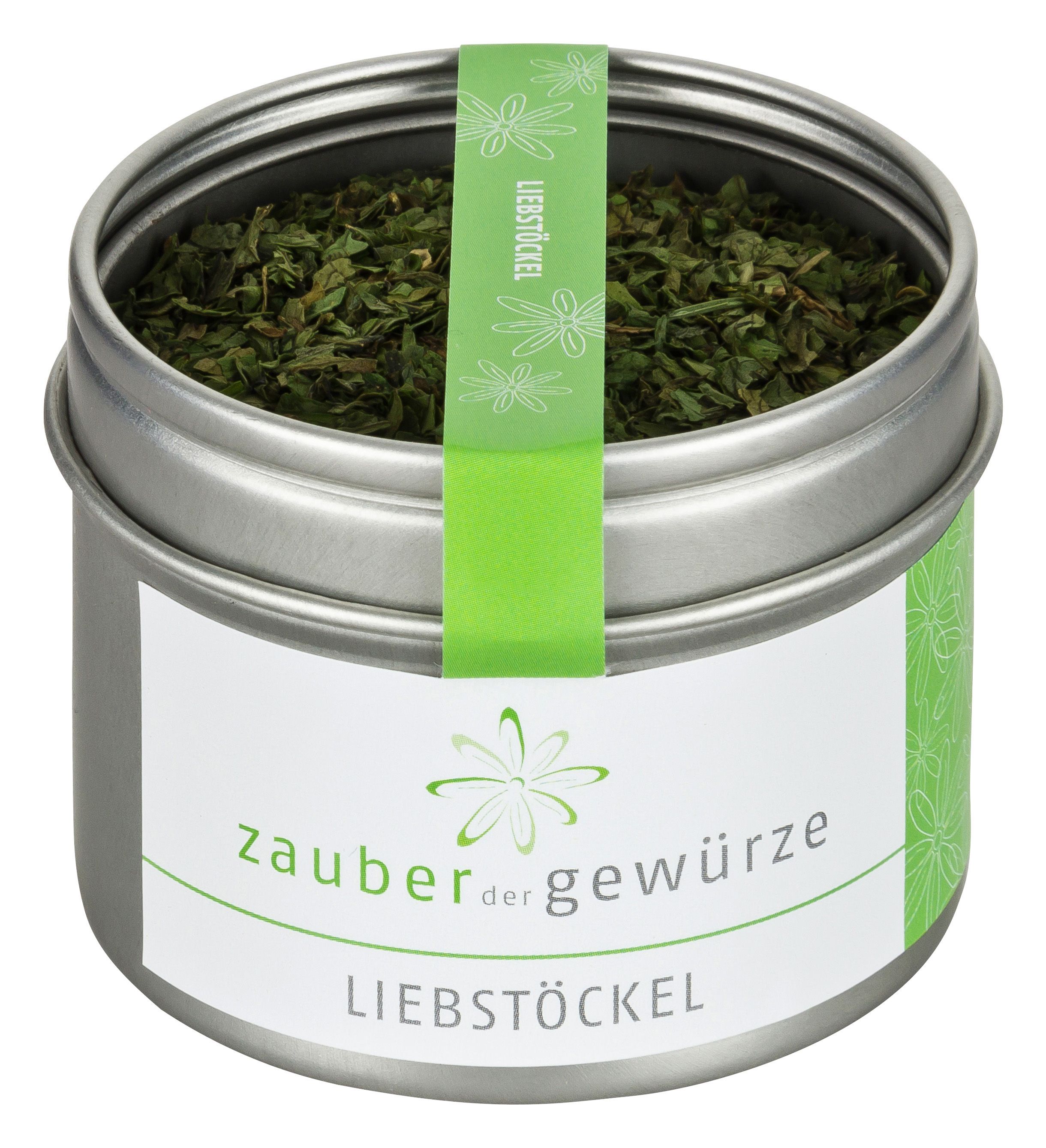 Runde Dose mit "Zauber der Gewürze Liebstöckel". Grüne Kräuter im Inneren. Grünes Etikett mit Schriftzug.